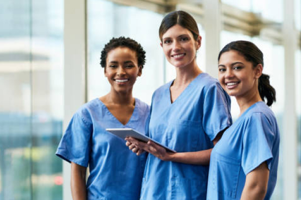 Three young female nurses smiling