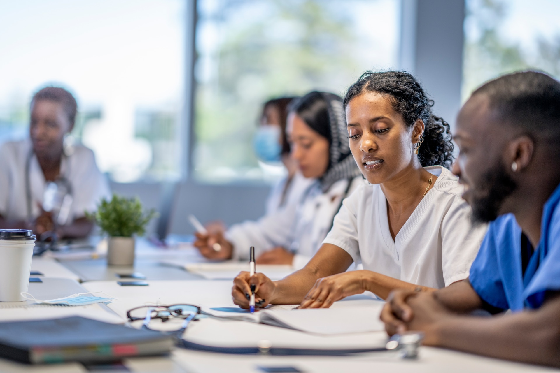 Group of people working at a table together